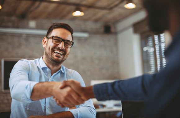 Close up of handshake in the office